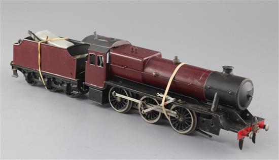 A Bassett-Lowke live steam O gauge 2-6-0 tender locomotive, unmarked crimson livery, (dissembled) but overall 46cm, needs attention